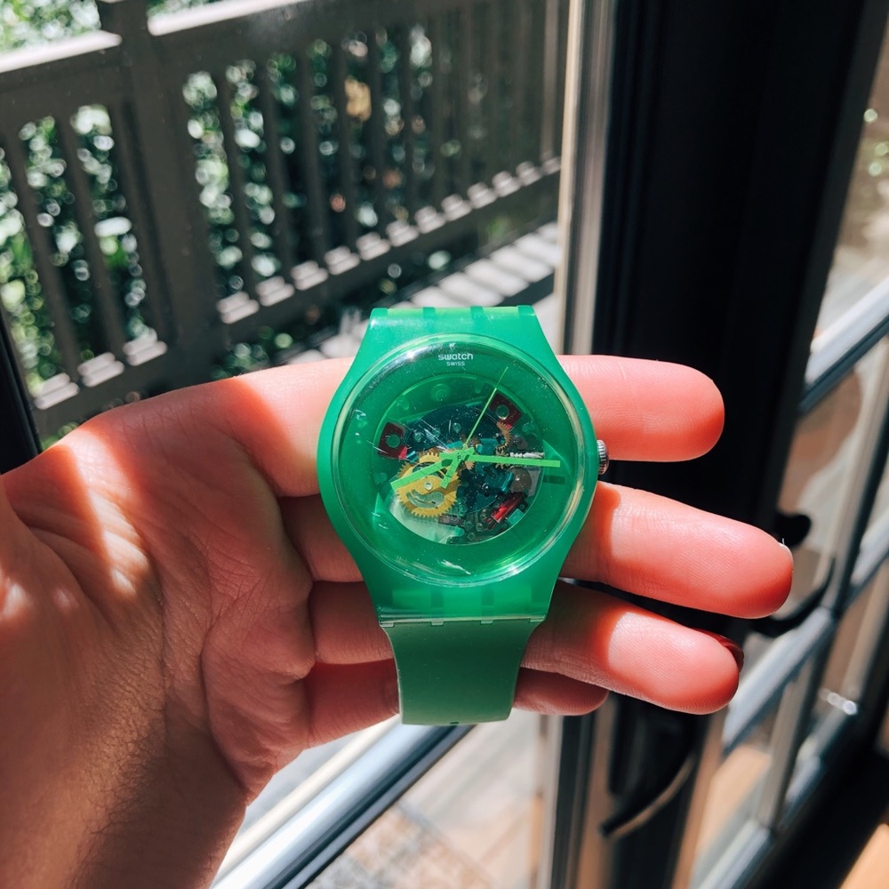 Open work green swatch watch